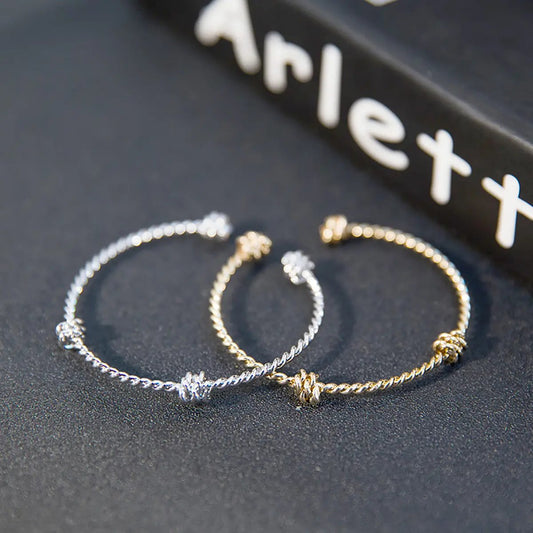 Three knotted opening bracelets null
